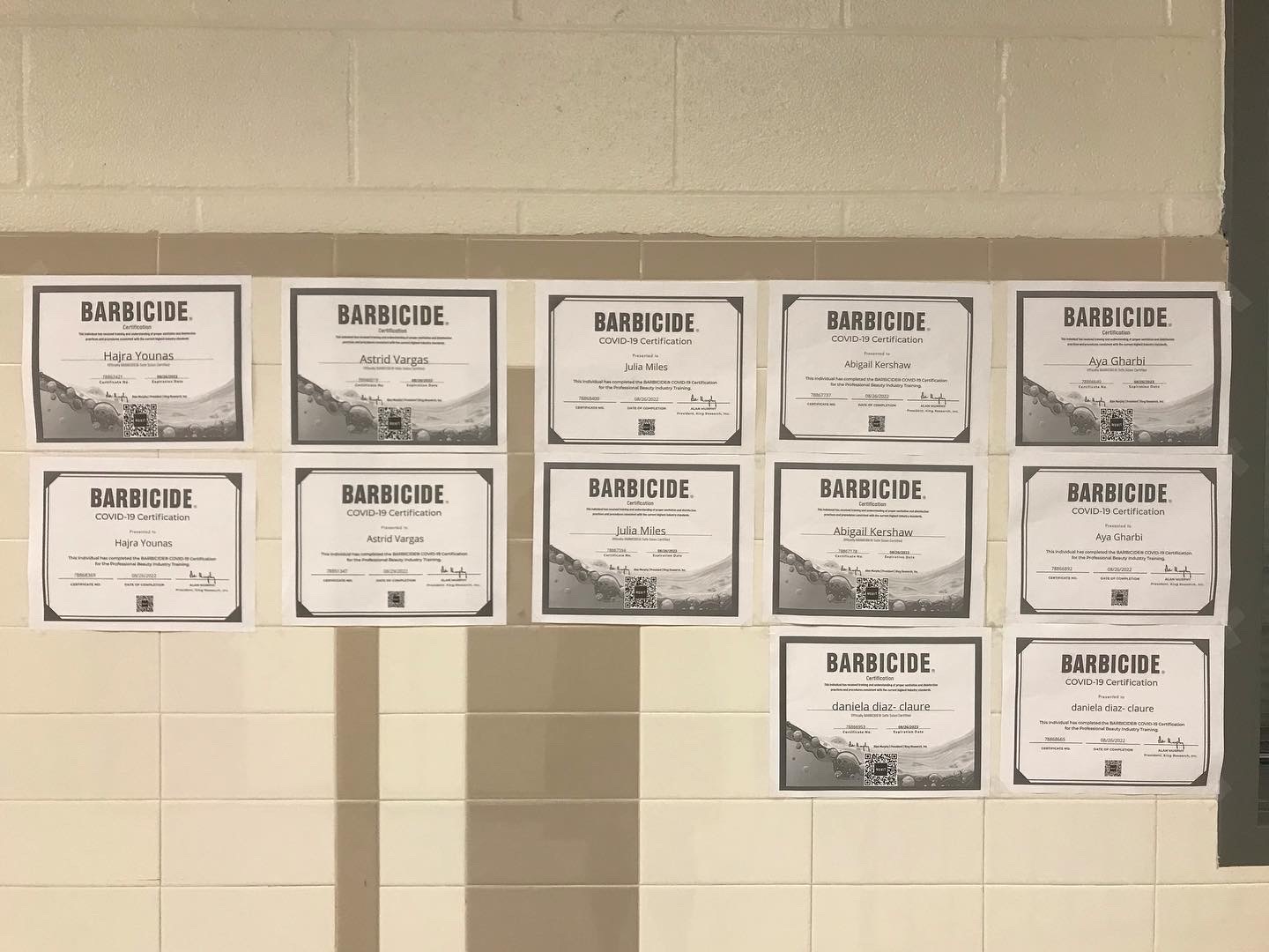 Barbacide Certifications on one side of classroom door