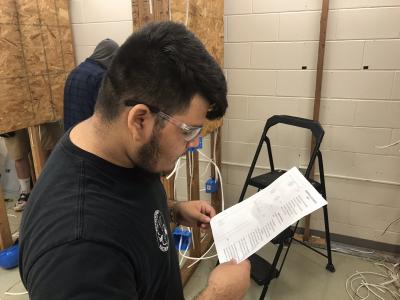 ECE student reads the specifications before starting the local competition hands-on activity. 