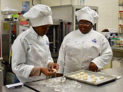 Culinary Students making dough and baking biscuits