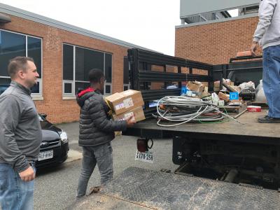 Students unload supplies donated by Corridon Electric