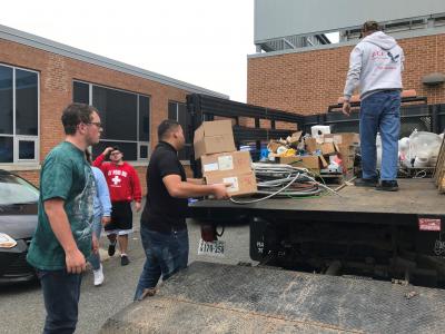Students unload supplies 