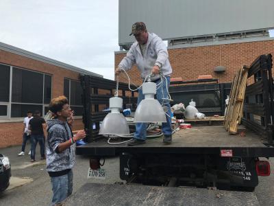 Student unload supplies donated by Corridon Electric