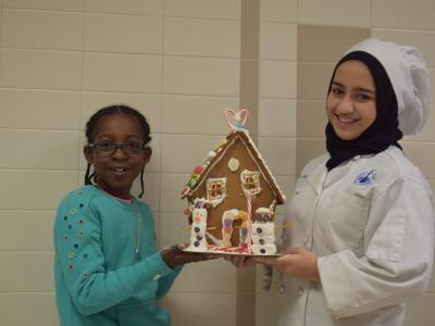 Young people with their gingerbread house