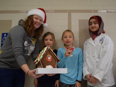 Young people with their gingerbread house