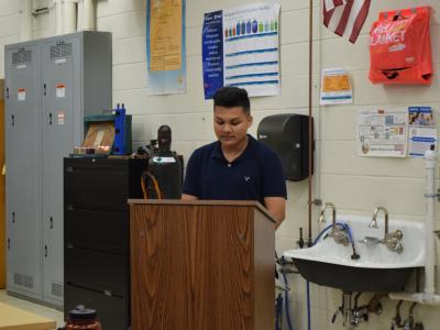 Student announcing his commitment to an employer to begin his training in the skilled trades profession.