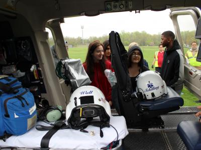 Students look inside the helicopter