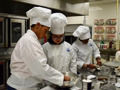 Culinary Students making dough and baking biscuits