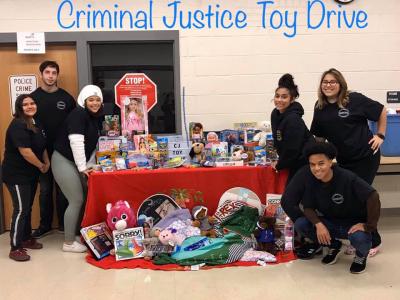 Criminal Justice students pose with donated toys. 